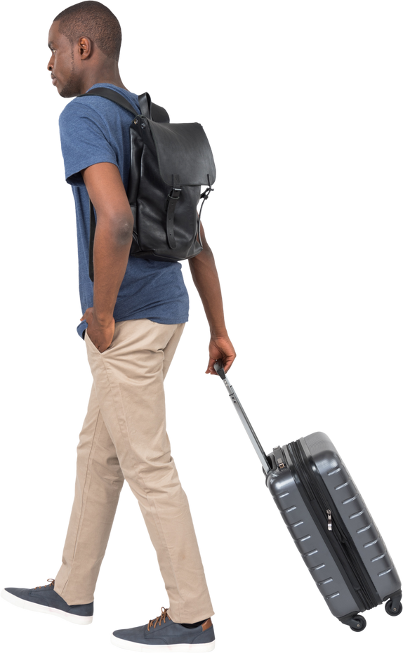 Man Carrying a Backpack and Dragging a Suitcase 