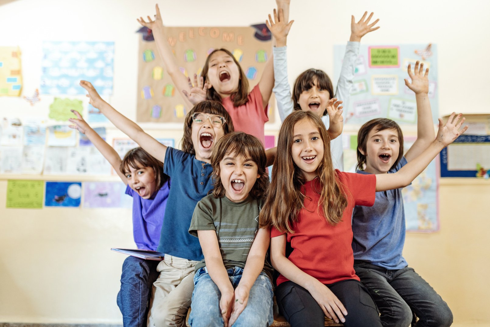 Group of elementary school kids celebrating the end of the school year